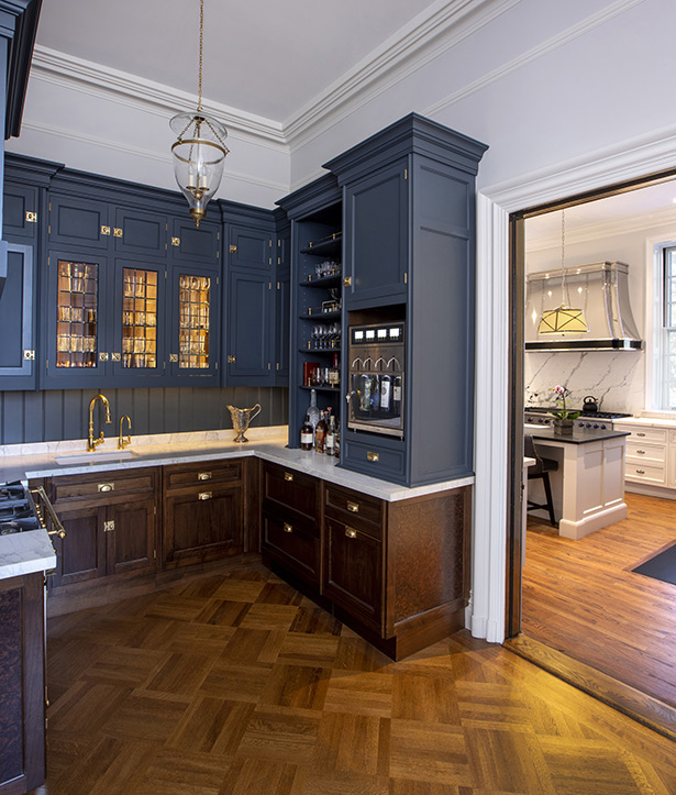 Located between the kitchen and dining room, the butler’s pantry serves as a backup kitchen with additional capacity for entertaining large groups. Among the amenities are a wine station, sink, LaCornue range, a dishwasher, and refrigeration drawers.